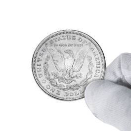 The 1878 Morgan Silver Dollar First Year of Issue Tribute 6700 0067 d coinhandshot