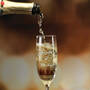 The Personalized Couples Champagne Flutes 10036 0049 c pouring champagne