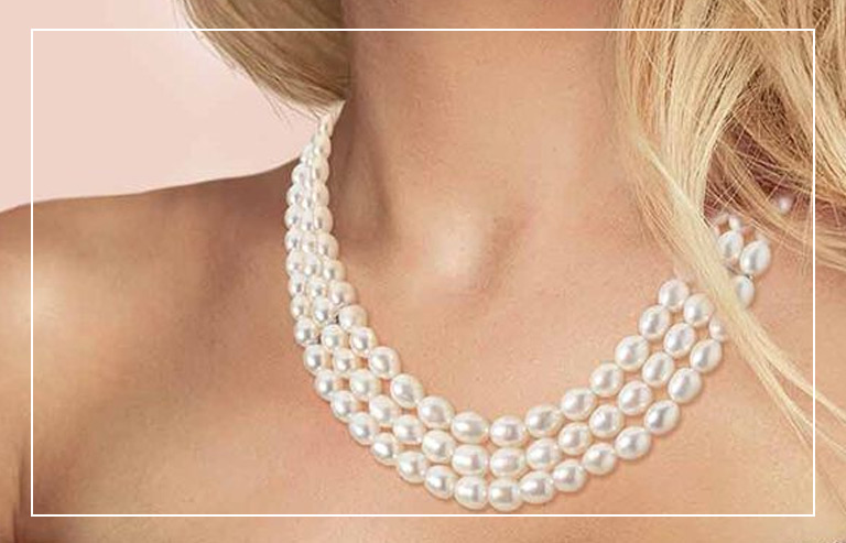 woman wearing a cultured pearl necklace